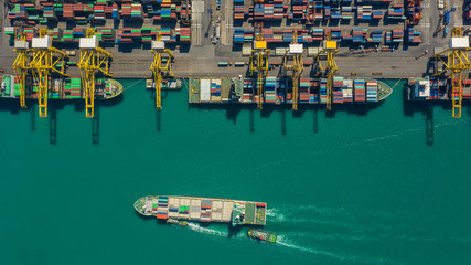 Fototapeta na wymiar Container ship in export and import business logistics and transportation. Cargo and container box shipping to harbor by crane. Water transport International. Aerial view and top view.