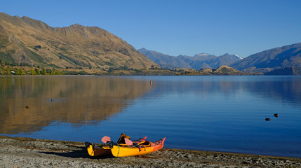 Kayaks on the lakefront, Lake Wanaka, Wanaka, New Zealand