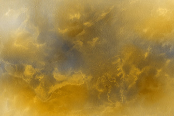 Gold luxury ink and watercolor textures on white paper background. Paint leaks and ombre effects. Hand painted vintage texture.