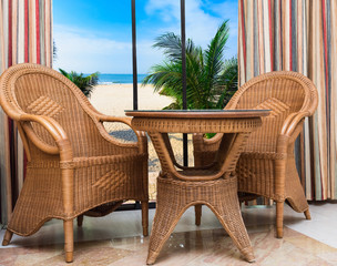 paradise hotel window palm tree furniture rattan