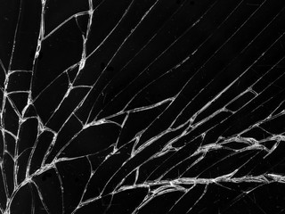 Cracked glass texture on black background. Isolated realistic cracked glass effect.