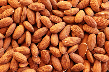 Fototapeta premium Close up of shelled almonds with skins on
