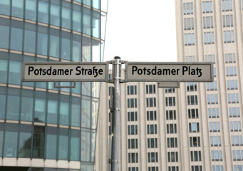 big road signs with street name of Potsdamer Strasse and Platz t