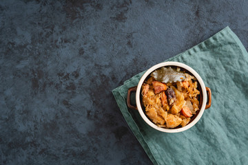 Bigos-traditional Polish dish of finely chopped sauerkraut and fresh cabbage with meat, mushrooms, and sausage. The dish is also traditional for Belarusian, Ukrainian and Lithuanian cuisine.