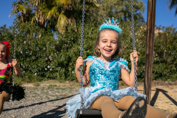  girl dressed as a princess plays in the field