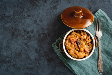 Bigos-traditional Polish dish of finely chopped sauerkraut and fresh cabbage with meat, mushrooms, and sausage. The dish is also traditional for Belarusian, Ukrainian and Lithuanian cuisine.