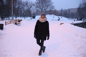 woman playing snow outside season winter clothes