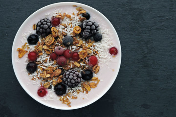 Delicious stylish breakfast with yogurt, granola and berries.