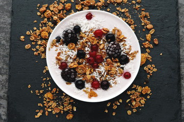 Delicious stylish breakfast with yogurt, granola and berries.