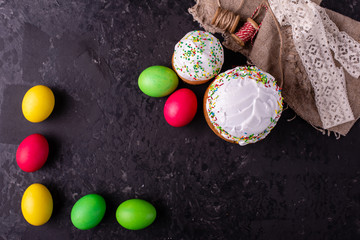 Easter, cake, eggs, holiday. Easter cake and colorful eggs on a dark background. It can be used as...
