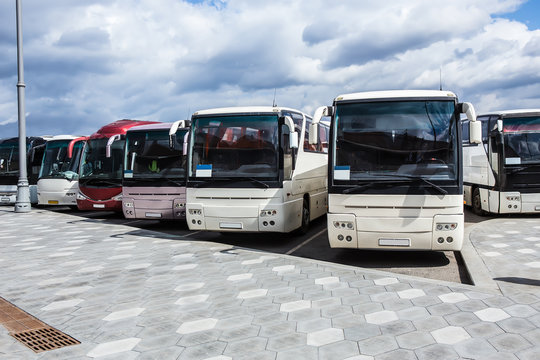 buses on parking on the background of cloudy sky