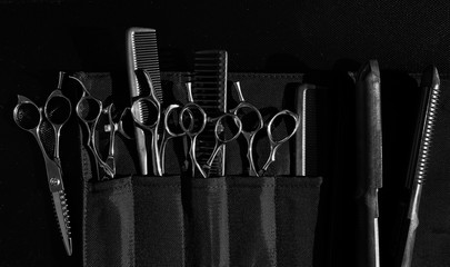 Stylish professional barber scissors and combs, hairdresser salon concept, hairdressing tool set....