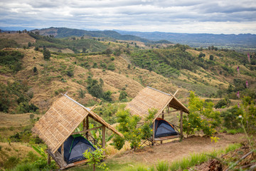 Camping tents in the cabin with mountain background
