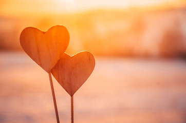 Hearts in warm winter snow - Valentine, romantic date or marriage concept photo with copy space