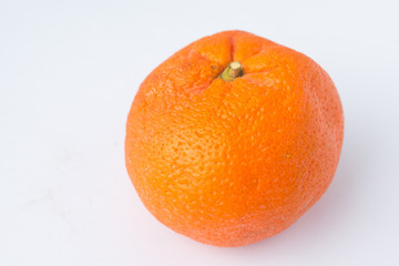 old tangerine on a white background