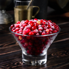 Red ripe fresh cranberries in rustic style, cowberry copyspace