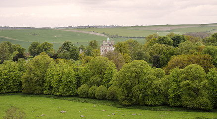 English landscape in rural Oxfordshire with large house amongst the trees