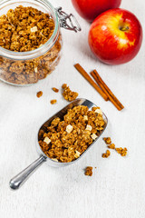 Scoop Full of Organic Apple Cinnamon Granola. Selective focus.