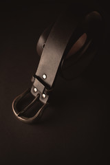 leather men's belt on brown background