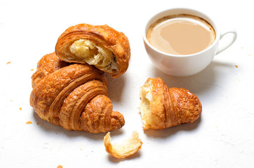 Croissants and Coffee Cup on White Background