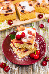 Tart Cherry Cake with Powdered Sugar. Panoramic image. Selective focus.