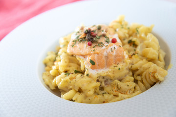 tasty pasta with salmon on a the table
