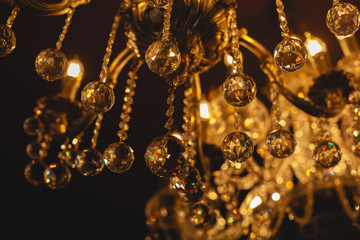 Large crystal chandelier close-up in baroque style