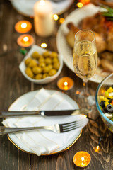 Festive champagne glass and romantic candlelit dinner