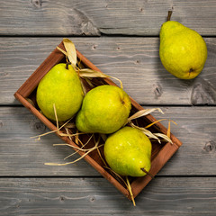 Fresh Green Pears on a Wooden Table Top View. Panoramic image. Selective focus.