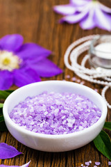 Obraz na płótnie Canvas Purple Clematis Spa Salt for Spa and Aromatherapy. Selective focus.
