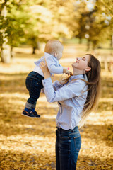 Fototapeta premium The concept of a happy family. Happy family in the park.