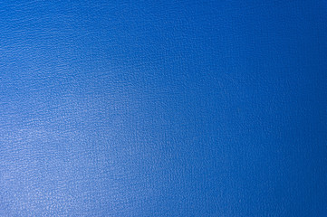 Textured background surface of textile upholstery furniture close-up. Blue color fabric structure