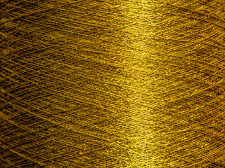 Macro shot of golden sewing threads or wires