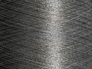 Macro shot of silver sewing threads or wires