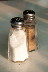 Containers with salt and pepper in restaurant in latin america, natural light.