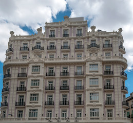 Fototapeta na wymiar Facades of neclassic buildings in Madrid, the capital of Spain