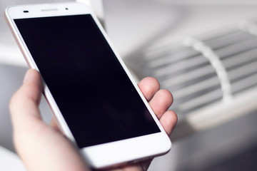 hand hold the smartphone with blur background for network concept