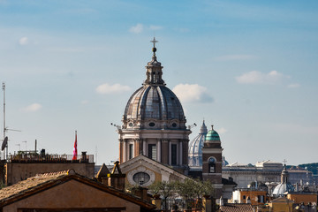 Fototapeta na wymiar Dome of the Basilica of SS. Ambrose and Charles on the Corso. Rome, Italy