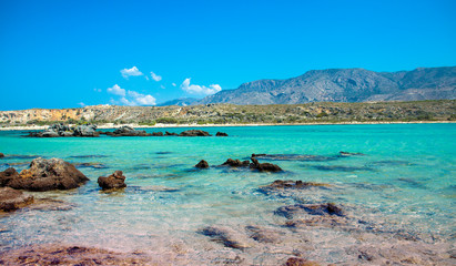 Obraz premium Elafonisi beach with pink sand on Crete, Greece. Beautiful beach with pink sand.