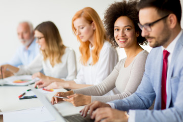 Businesspeople sitting  in conference room during meeting at office