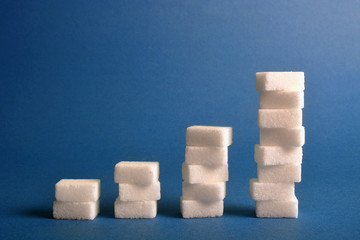 Stacks of sugar cubes in the shape of a diagram.