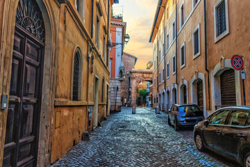 Traditional Rome street in the centre, stone pavement and ancien