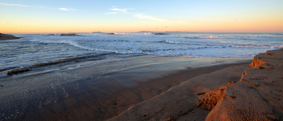 Dawn sunrise view of Santa Clara river flowing into Pacific ocean on the gold coast of California at Ventura California United States