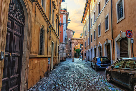 Traditional Rome street in the centre, stone pavement and ancien - Powered by Adobe