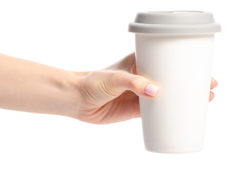 White cup mug with gray lid in hand on white background isolation