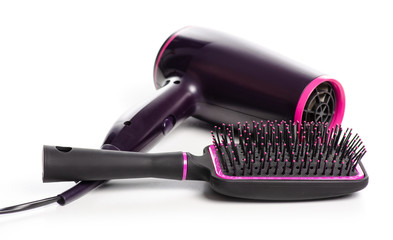 Hair dryer and hairbrush on a white background isolation