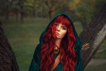 cute red-haired girl, looks into the camera with brown eyes, wearing an emerald raincoat with a...