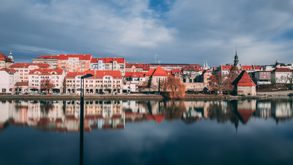 Fototapeta premium Reflection of building in the lent district on the river Drava in Maribor, Slovenia