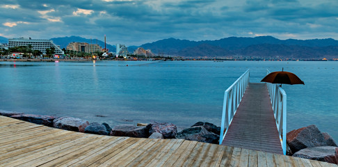 Morning view on the gulf of Aqaba and resort hotels from the central beach of Eilat - famous tourist resort and recreational city in Israel