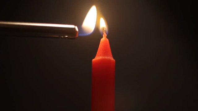 lighting a red candle